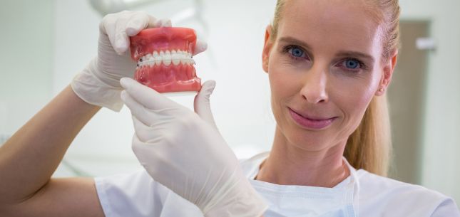 a man is getting dental treatment.